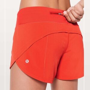 Lululemon Speed Up 4 in Orange Shorts